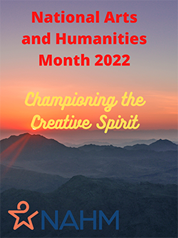 Photo of a misty mountain landscape at sunrise or sunset. Red font at the top reads: National Arts & Humanities Month 2022. Yellow script font in the middle reads: Championing the Creative Spirit.
